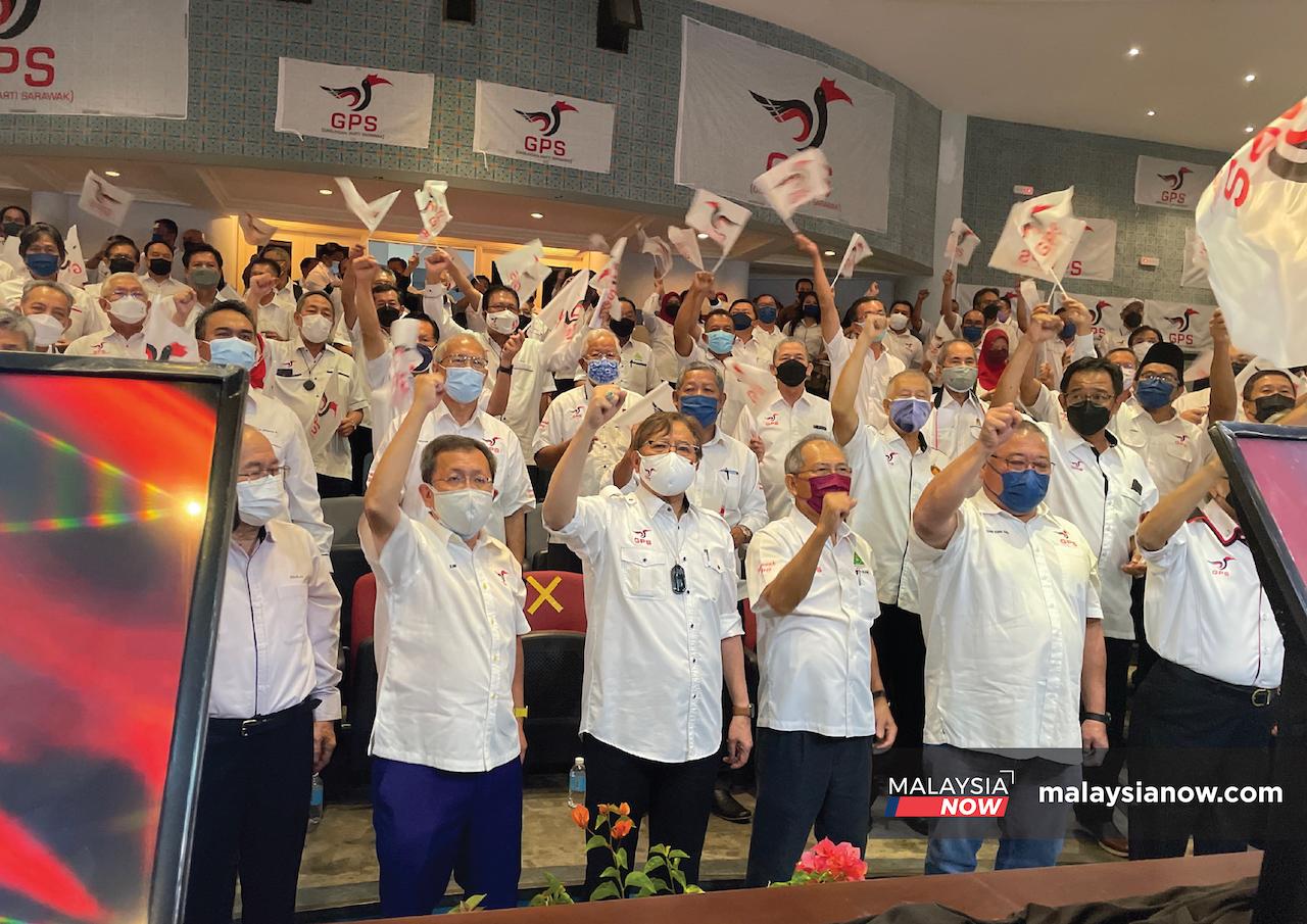 Gabungan Parti Sarawak chairman Abang Johari Openg (centre) leads the crowd in a cheer at a launching ceremony in Kuching today.
