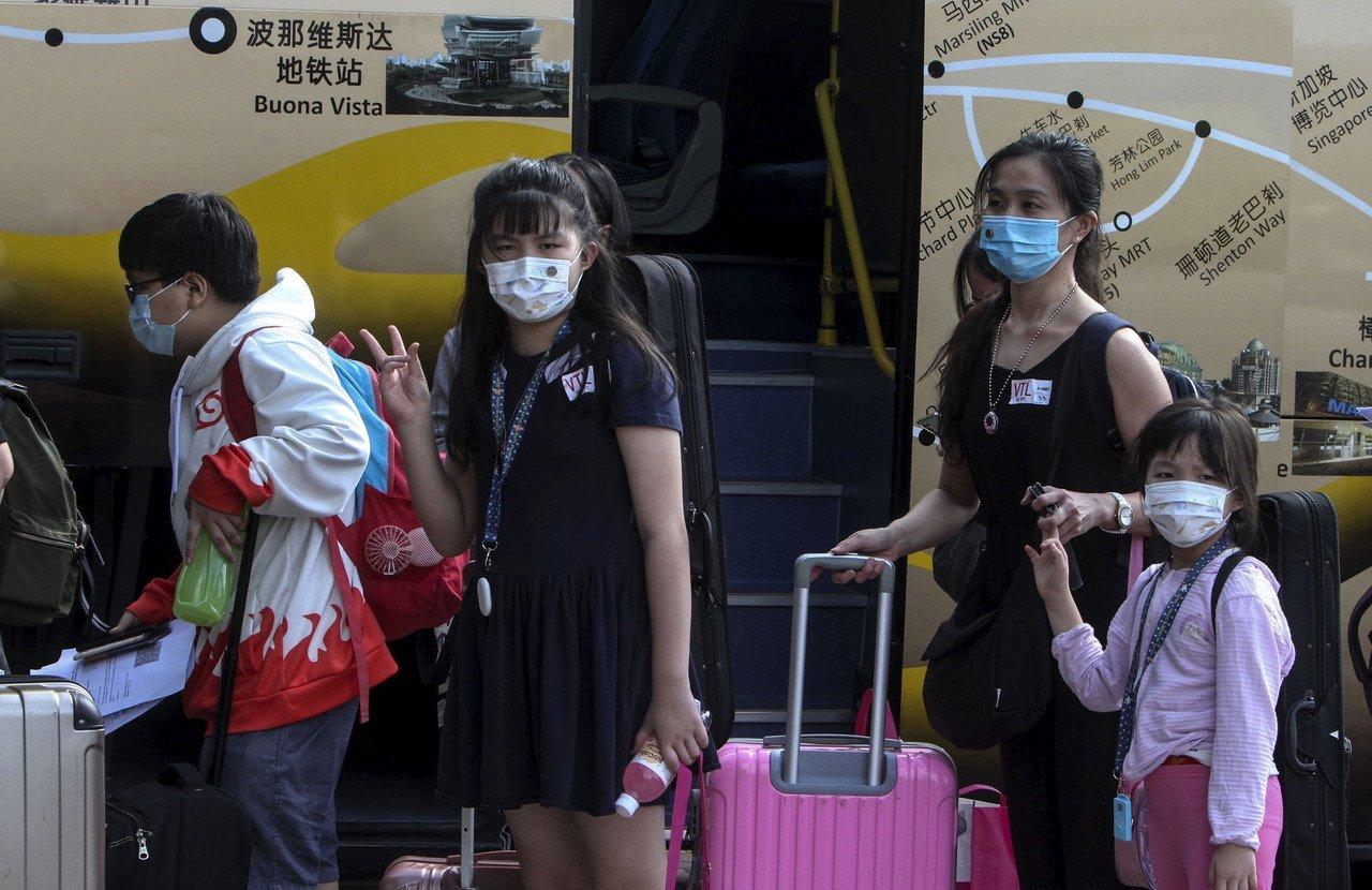 Travellers from Singapore arrive at the Larkin bus station in Johor Bahru as the border reopens under the Malaysia-Singapore Vaccinated Travel Lane. Photo: Bernama
