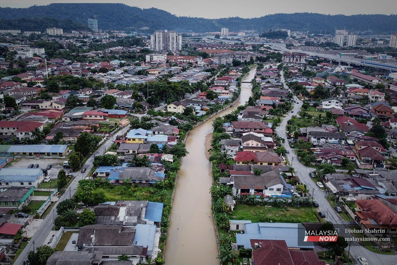 An aerial view of the Klang River snaking through Kampung Melayu Ampang in Selangor. Concerns have been raised over a joint venture for a mega development project along the Klang River involving a state government subsidiary in critical financial shape.
