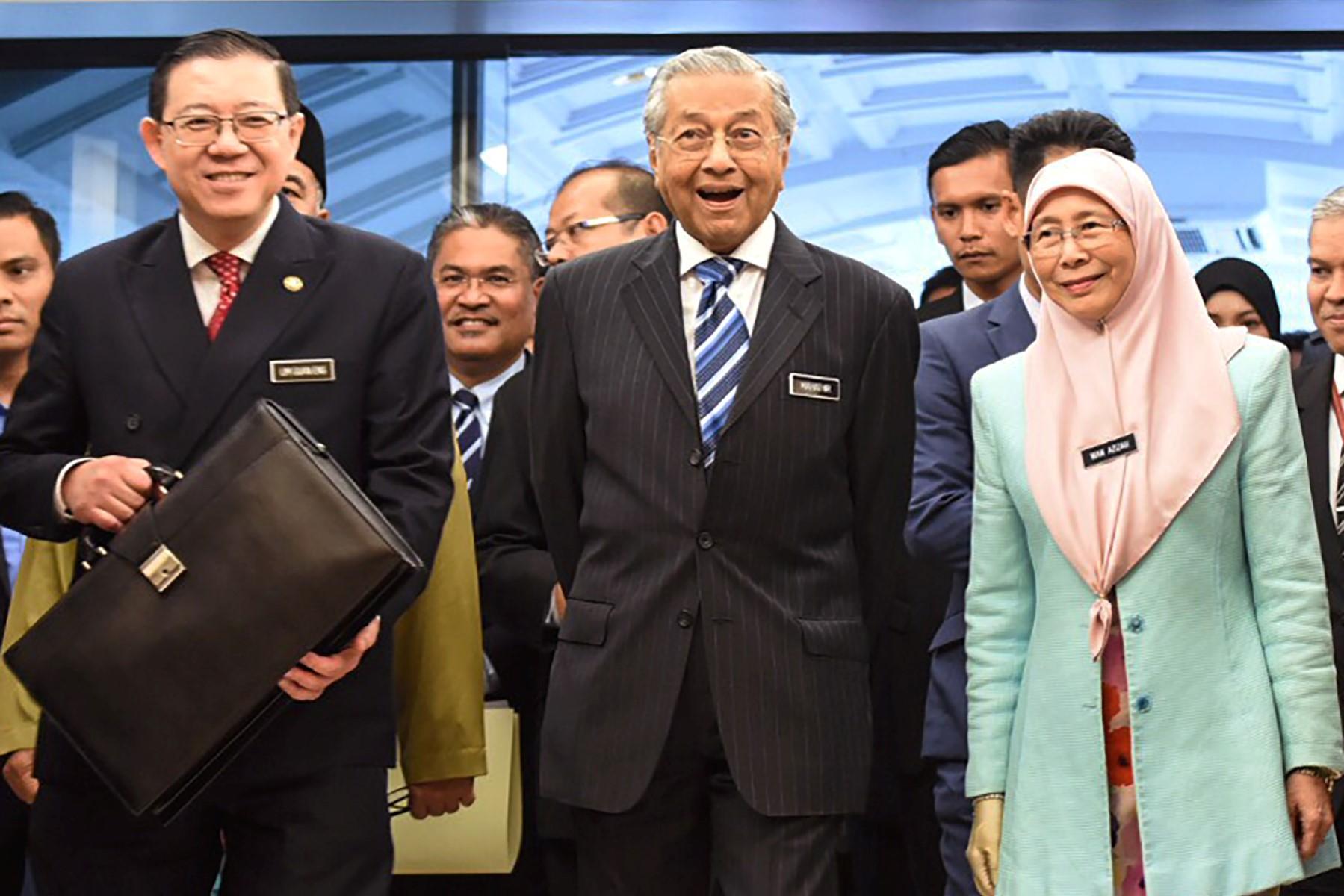 Former prime minister Dr Mahathir Mohamad (centre) with then finance minister Lim Guan Eng and deputy prime minister at the time, Dr Wan Azizah Wan Ismail before the tabling of the 2019 budget in Parliament. Photo: AFP