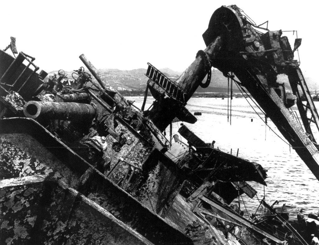 In this May 24, 1943 file photo, the capsized battleship USS Oklahoma is lifted out of the water at Pearl Harbor in Honolulu, Hawaii. Photo: AP