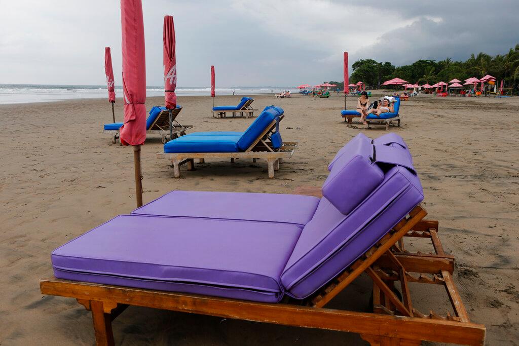 Empty sun chairs scatter a beach as tourism on the resort island has dropped due to the coronavirus outbreak in Bali, Indonesia on March 12, 2020. Photo: AP