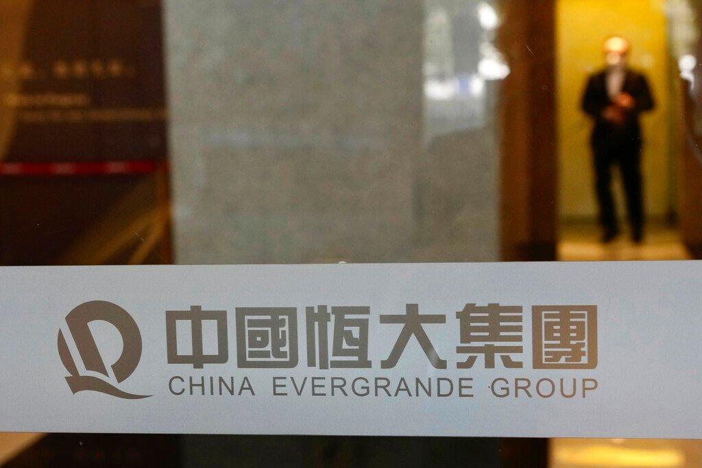 A security guard stands on duty at the headquarters of China Evergrande Group in Hong Kong, Oct 4. Photo: AP