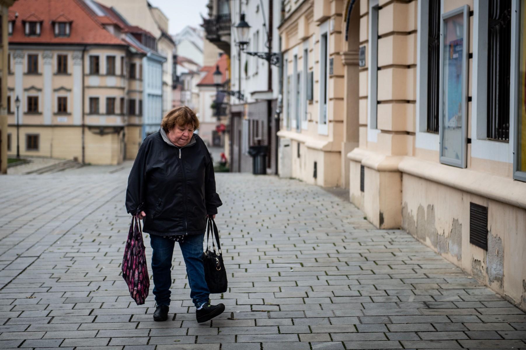 A woman carries shopping bags in downtown Bratislava on Nov 25. Photo: AFP