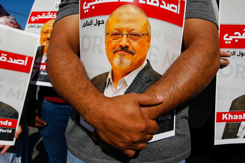 People hold posters of slain Saudi journalist Jamal Khashoggi near the Saudi Arabia consulate in Istanbul, marking the two-year anniversary of his death on Oct 2, 2020. Photo: AP
