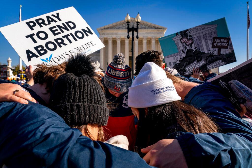A group of anti-abortion protesters gather together in front of the US Supreme Court in Washington, Dec 1. Photo: AP