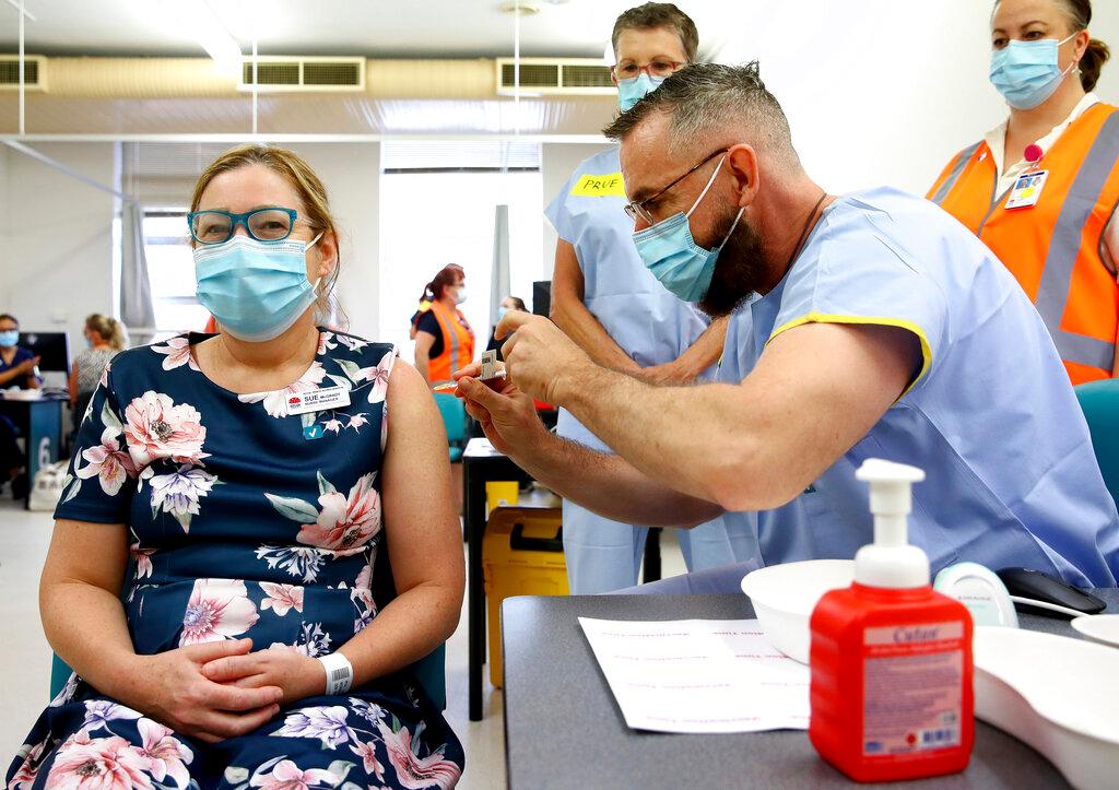 A nurse receives a shot of the Pfizer vaccine for Covid-19 at the Royal Prince Alfred Hospital Vaccination Hub in Sydney, Australia, in this Feb 22 file photo. Photo: AP