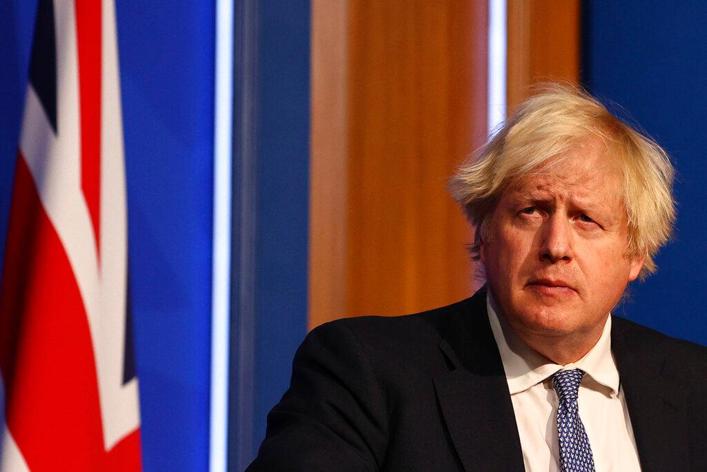Britain's Prime Minister Boris Johnson speaks at a press conference in London's Downing Street, Dec 8. Photo: AP