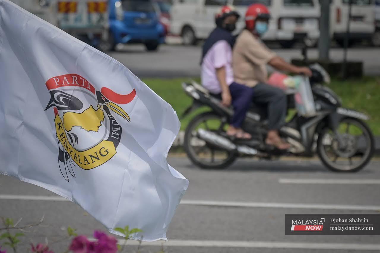 A Parti Bumi Kenyalang flag waves in the breeze at a junction in Kuching ahead of the Sarawak state election on Dec 18.