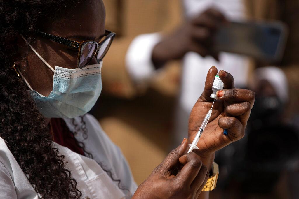 A health worker prepares a dose of China's Sinopharm vaccine during the start of a vaccination campaign against Covid-19 at the health ministry in Dakar, Senegal, in this Feb 23 file picture. Photo: AP