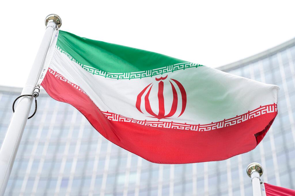 The flag of Iran waves in front of the International Centre building with the headquarters of the International Atomic Energy Agency, in Vienna, Austria, May 24. Photo: AP