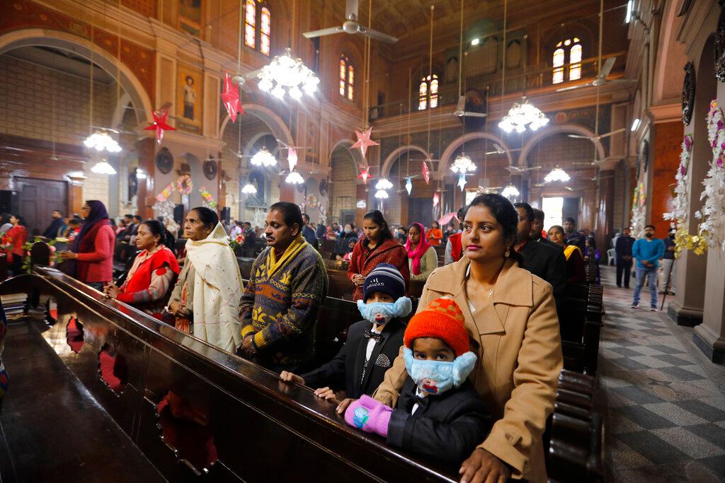Indian Christians, some wearing face masks as a precaution against the coronavirus, attend a Christmas mass at St Joseph's Cathedral in Prayagraj, India, in this Dec 25, 2020 file photo. Activists say that religious minorities in India have faced increased levels of discrimination and violence since Narendra Modi's Hindu nationalist Bharatiya Janata Party came to power in 2014. Photo: AP
