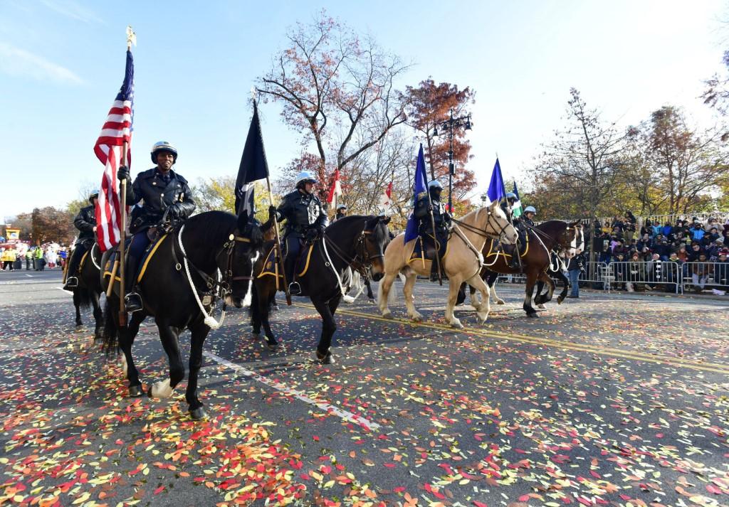 Members of NYPD march as Thanksgiving Day ushers in the Holiday Season on Nov 25 in New York City. Photo: AFP