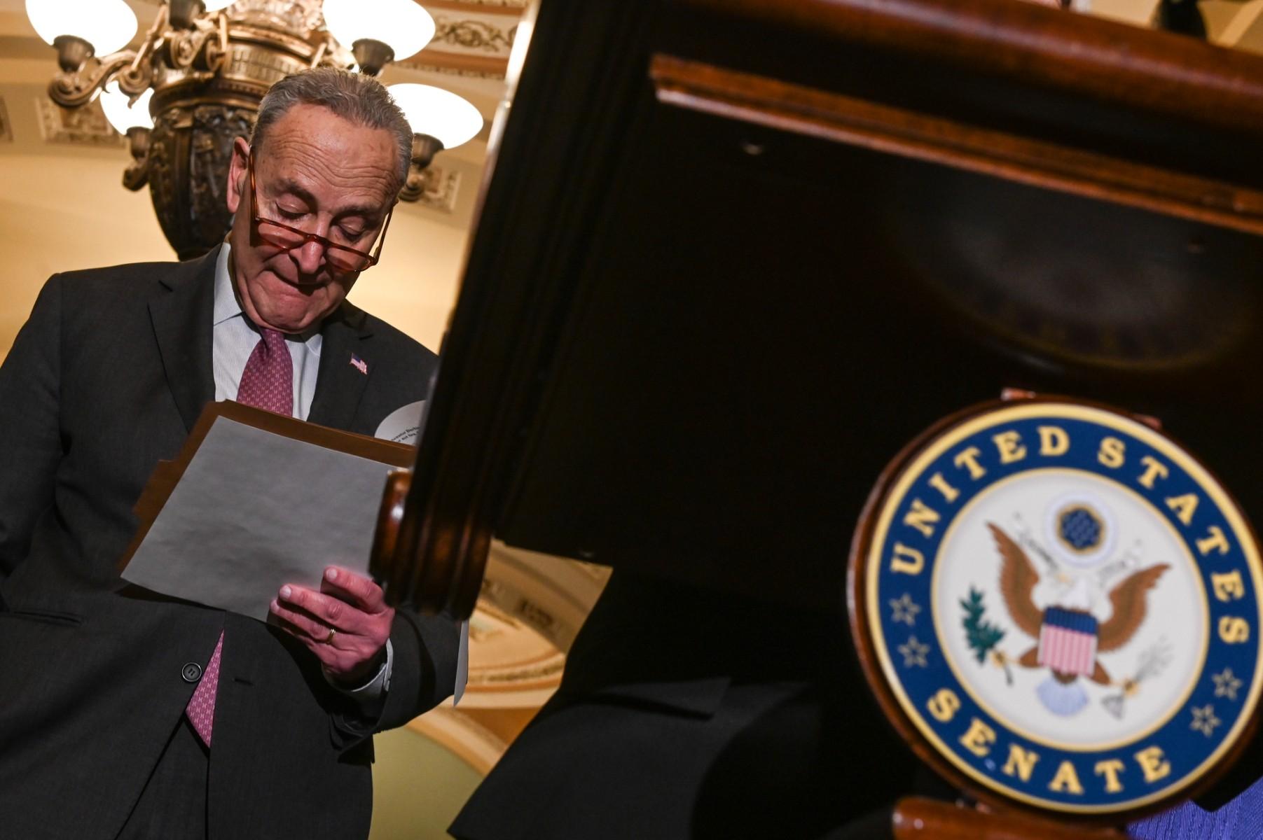 US Senate Majority leader Chuck Schumer waits to speak to journalists after a policy luncheon in Capitol Hill, in Washington, DC, on Dec 14. Photo: AFP