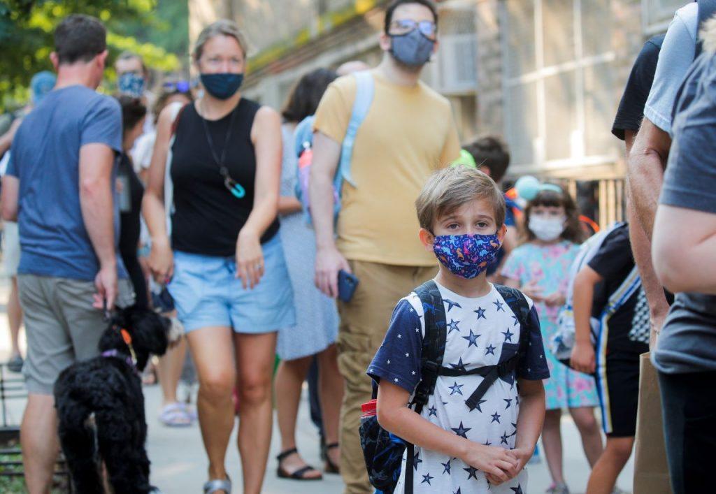 A child wears a face mask on the first day of school, amid the Covid-19 pandemic in Brooklyn, New York, Sept 13. Photo: Reuters