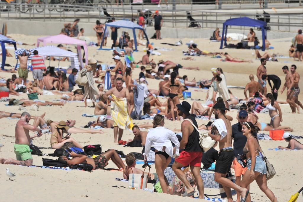 Beachgoers enjoy a sunny day on Bondi beach in Sydney on Dec 15, as Covid-19 restrictions are further eased across the New South Wales state. Photo: AFP