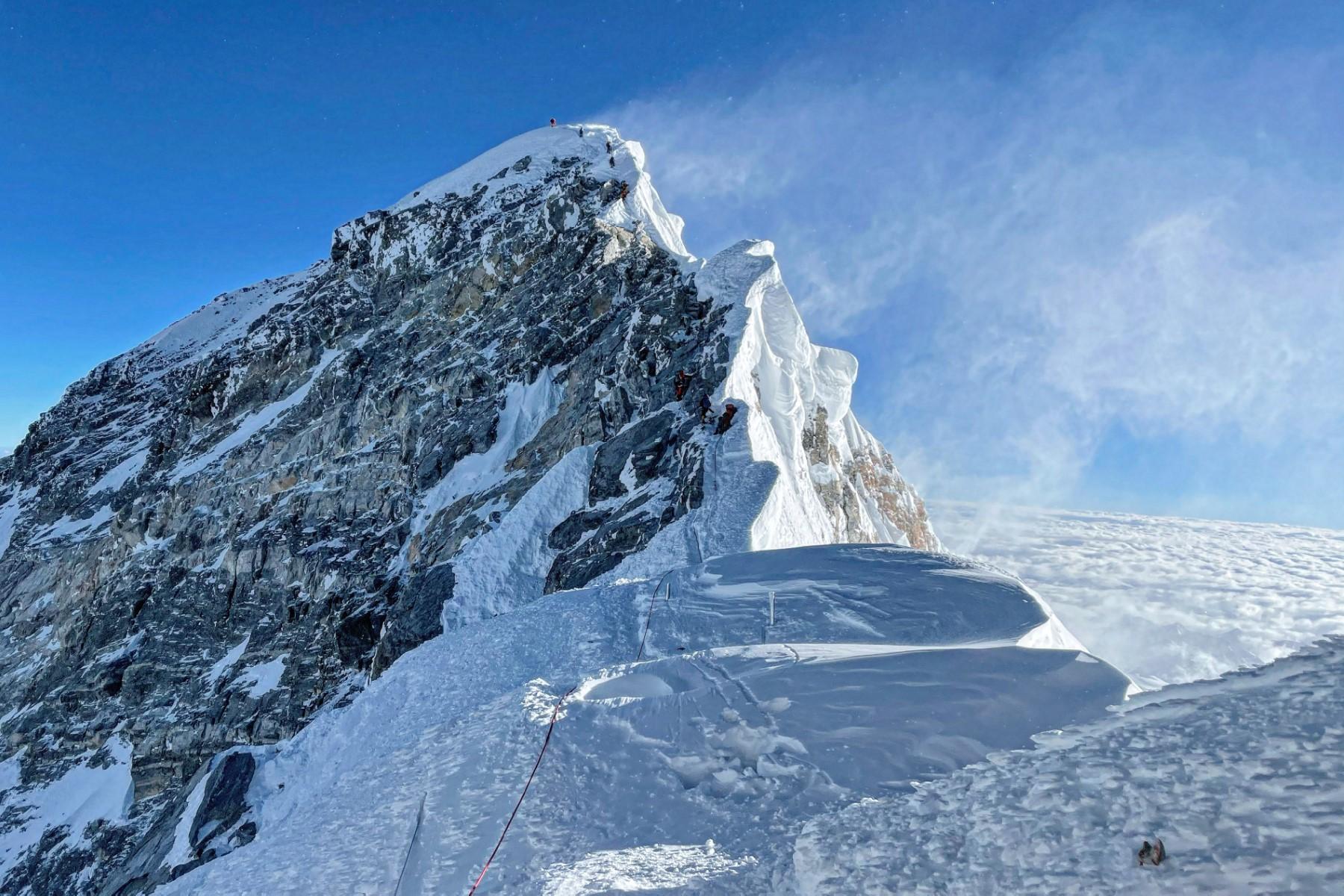 This photograph taken on May 31 shows mountaineers climbing the Hillary Step during their ascend of the South face to summit Mount Everest, in Nepal. Photo: AFP