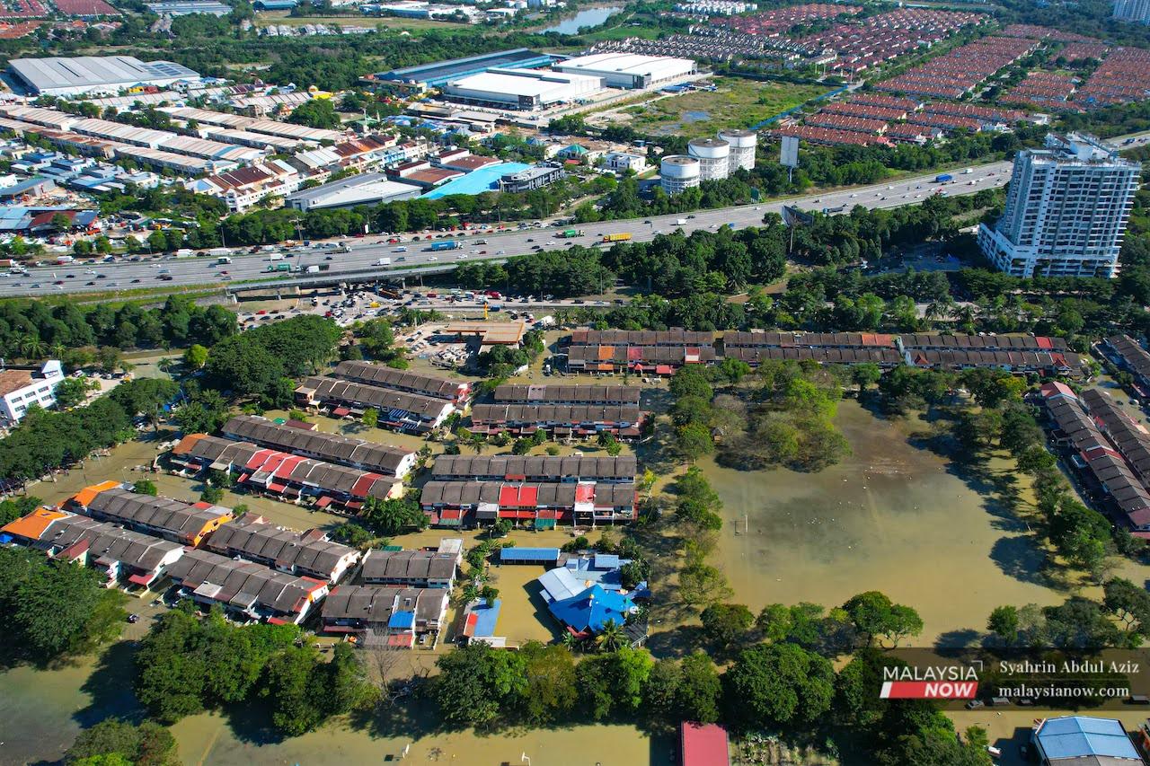 An aerial view of the floodwaters that covered Taman Sri Muda in Shah Alam after last week's torrential rain.