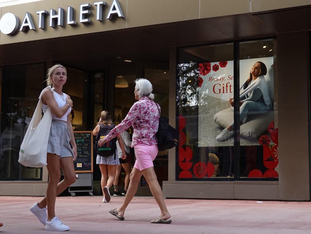 People walk past a retail store at the Lincoln Road mall on Dec 14, in Miami Beach, Florida. Photo: AFP