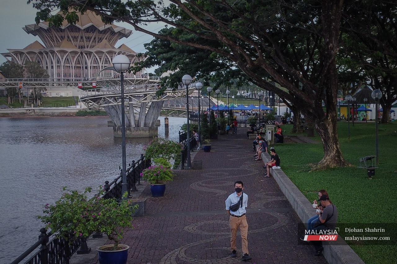 People stroll about at the Waterfront in Kuching, Sarawak.