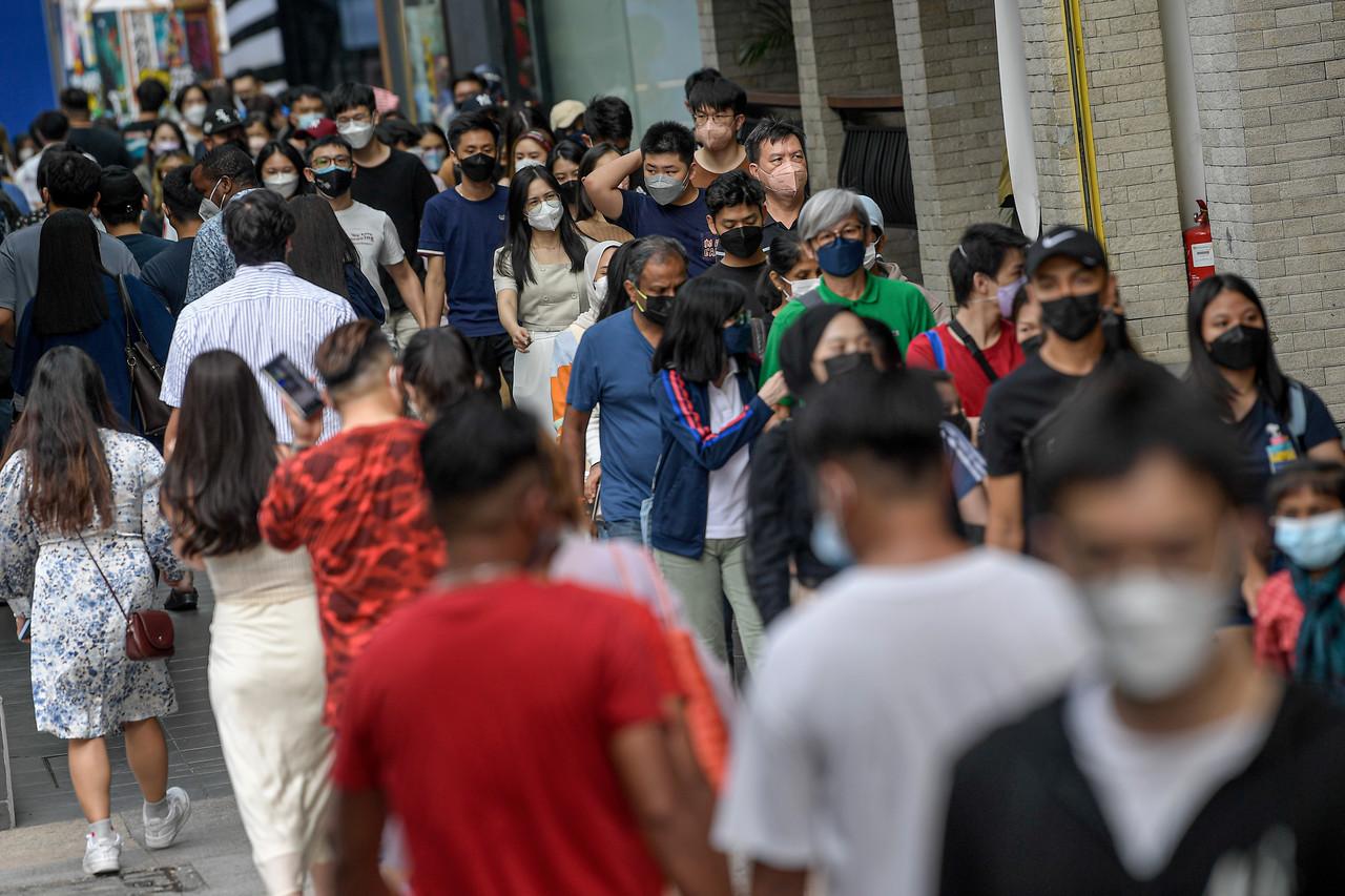 Pedestrians stroll about in the Bukit Bintang shopping district near the Pavilion mall in Kuala Lumpur on Dec 25. Photo: Bernama
