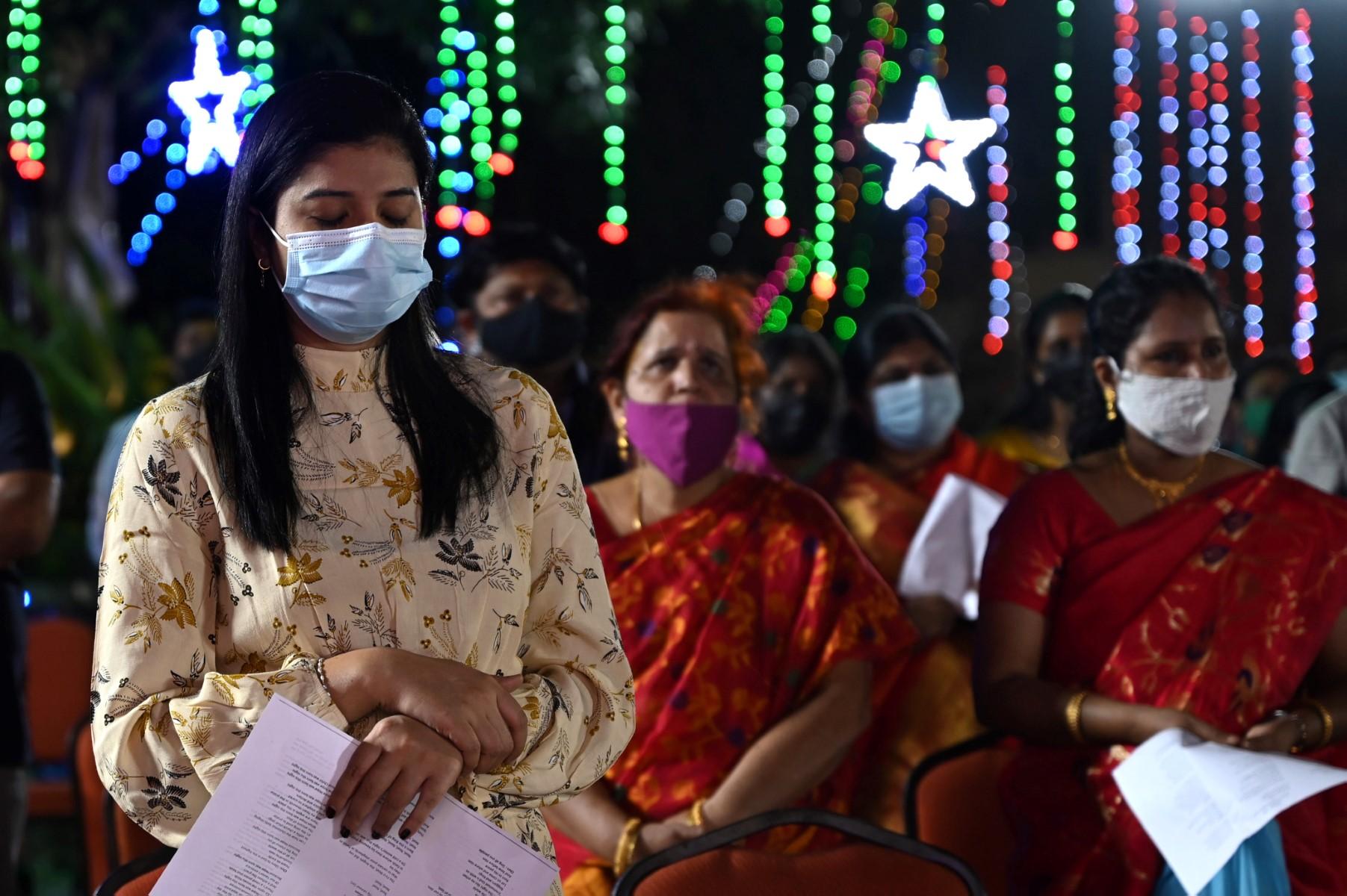 Christian devotees pray at Our Lady of Light Church on Christmas Eve in Chennai, on Dec 24. Photo: AFP