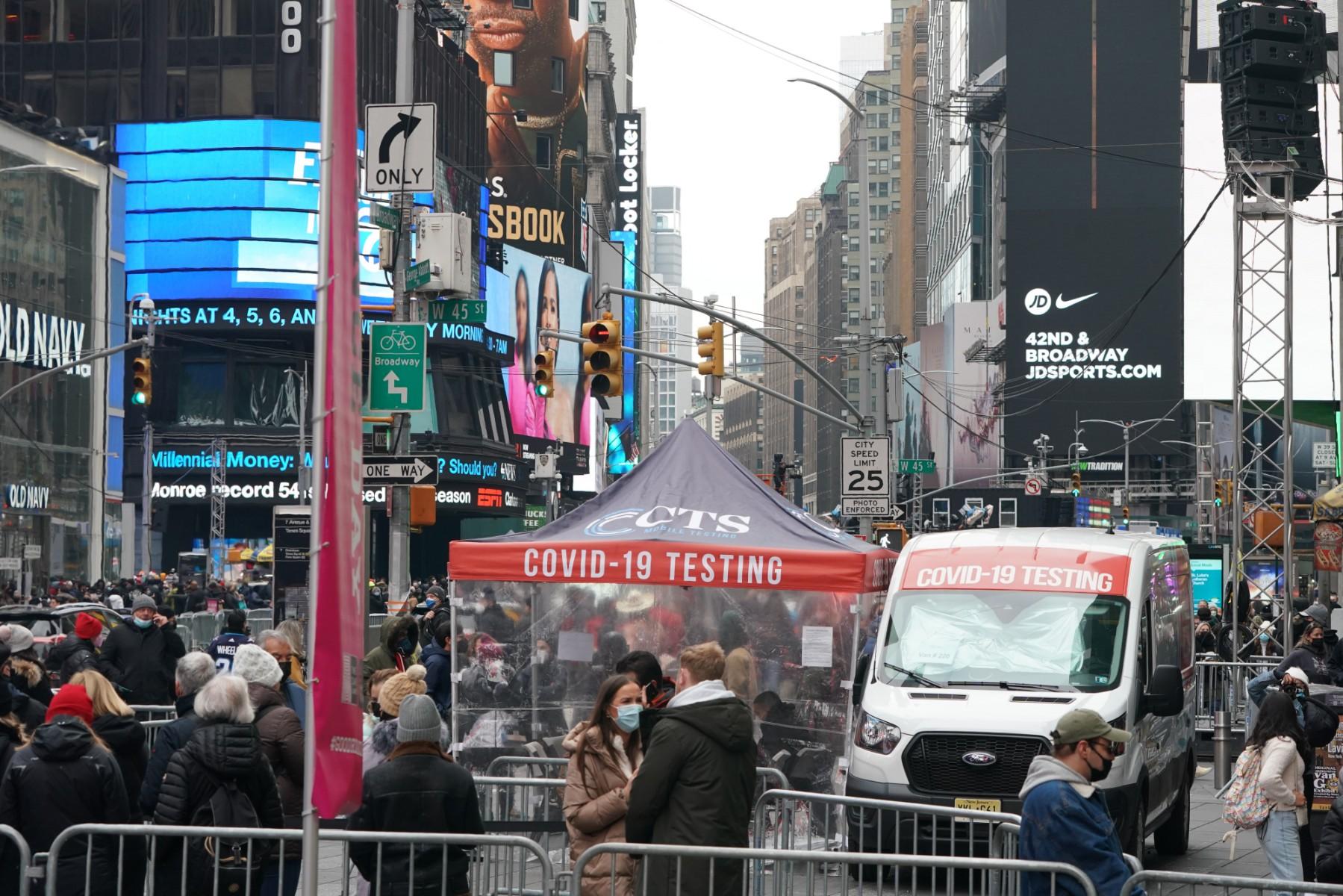 People stand in line for a Covid-19 test at a mobile testing site in Times Square on Dec 28 in New York. Photo: AFP