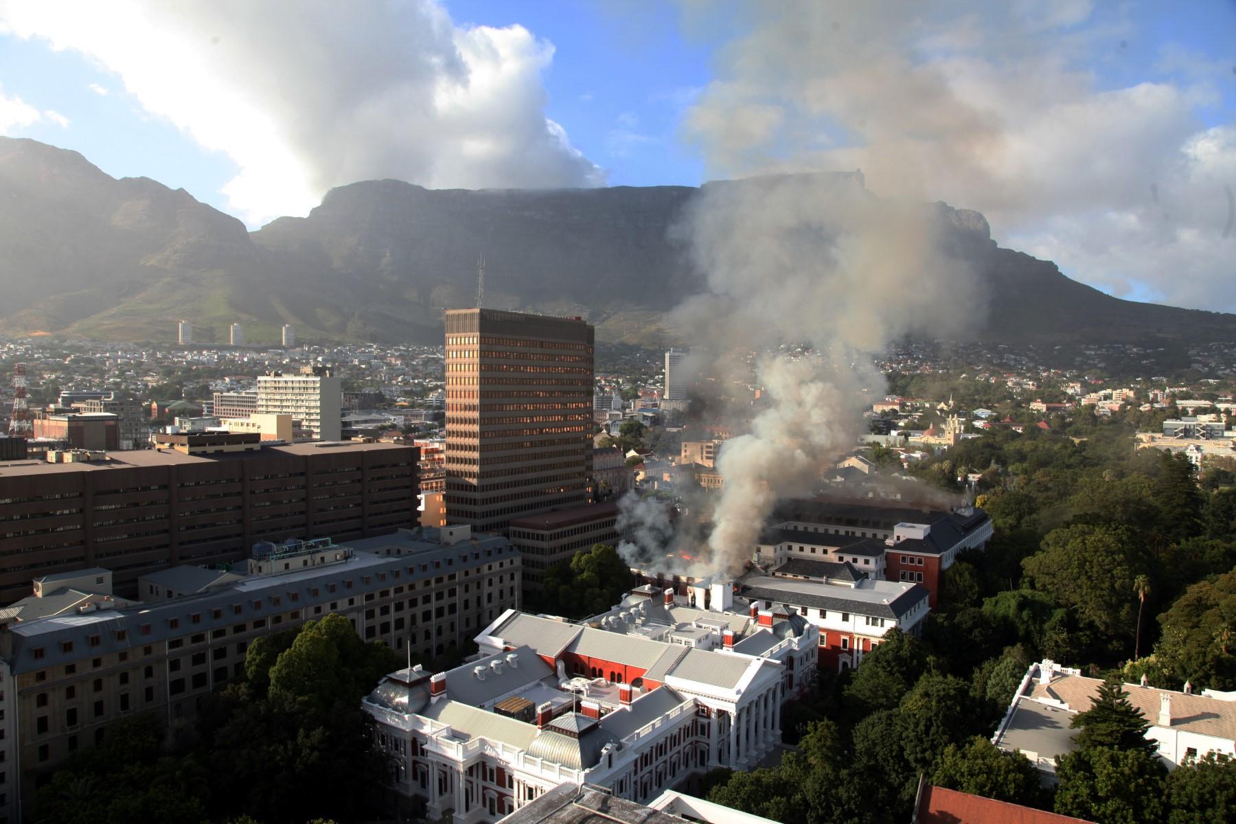 A general view of a building on fire at the South African parliament precinct in Cape Town on Jan 2. Photo: AFP