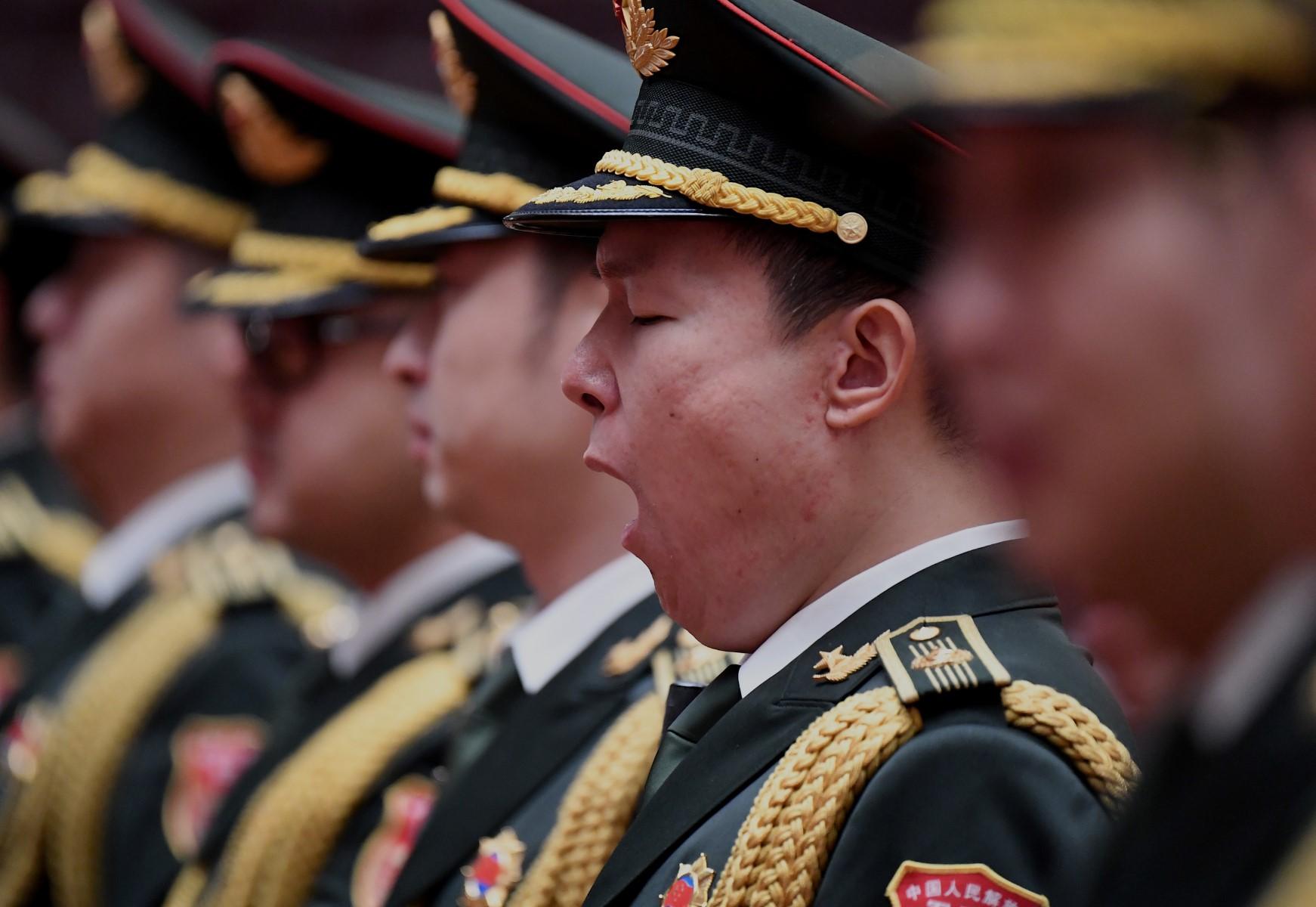 A member of the military band yawns before the start of the commemoration of the 110th anniversary of the Xinhai Revolution. There are growing global concerns about China's military modernisation. Photo: AFP