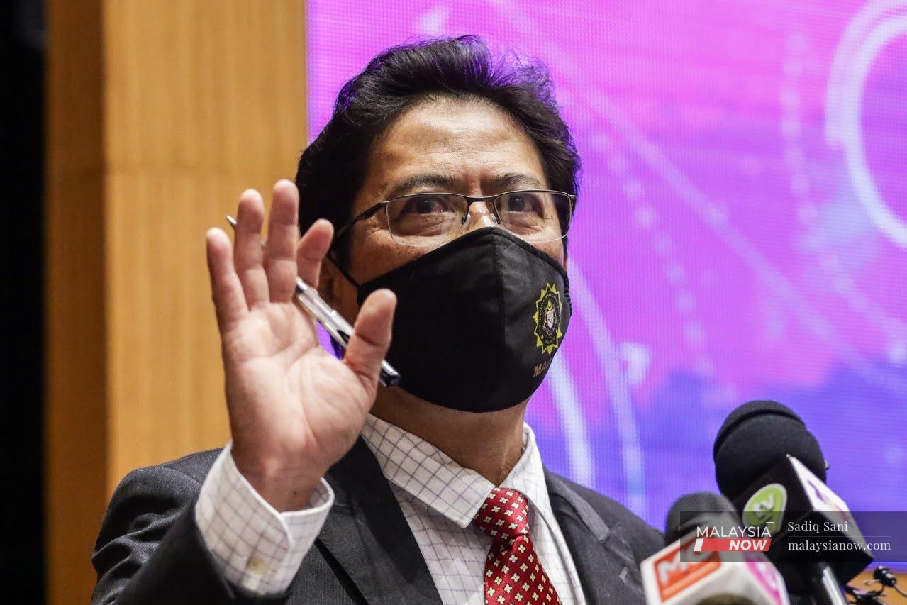 Malaysian Anti-Corruption Commission chief commissioner Azam Baki gestures during a press conference in Putrajaya today.