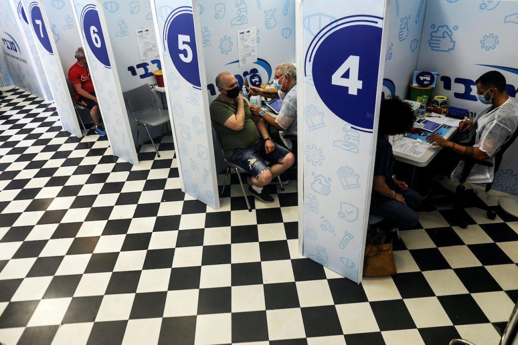 Israelis receive their third shot of Covid-19 vaccine as the country launches booster shots for over 30-year-olds, in Rishon Lezion, Israel, in this Aug 24, 2021 file picture. Photo: Reuters