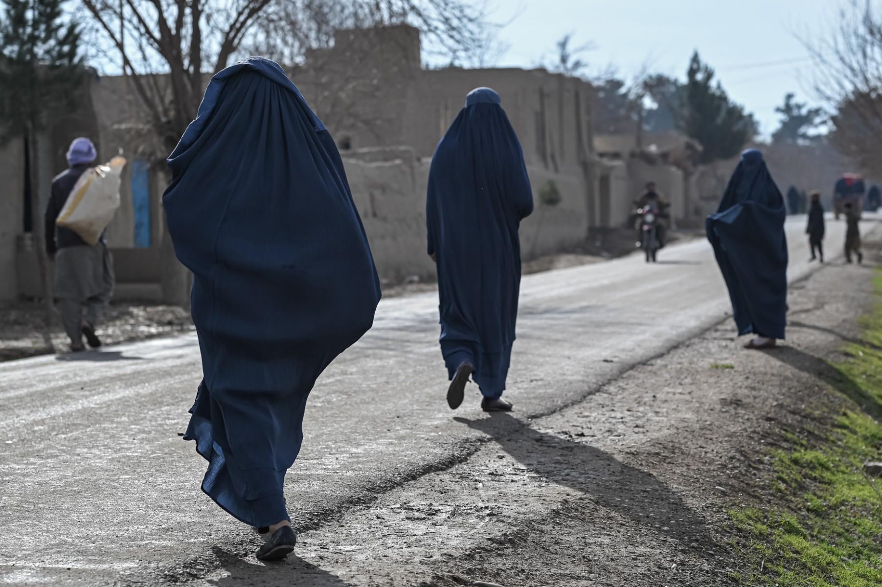 Women wearing burqas walk on a street in Balkh, northwest of Mazar-i-Sharif on Dec 22, 2021. Photo: AFP