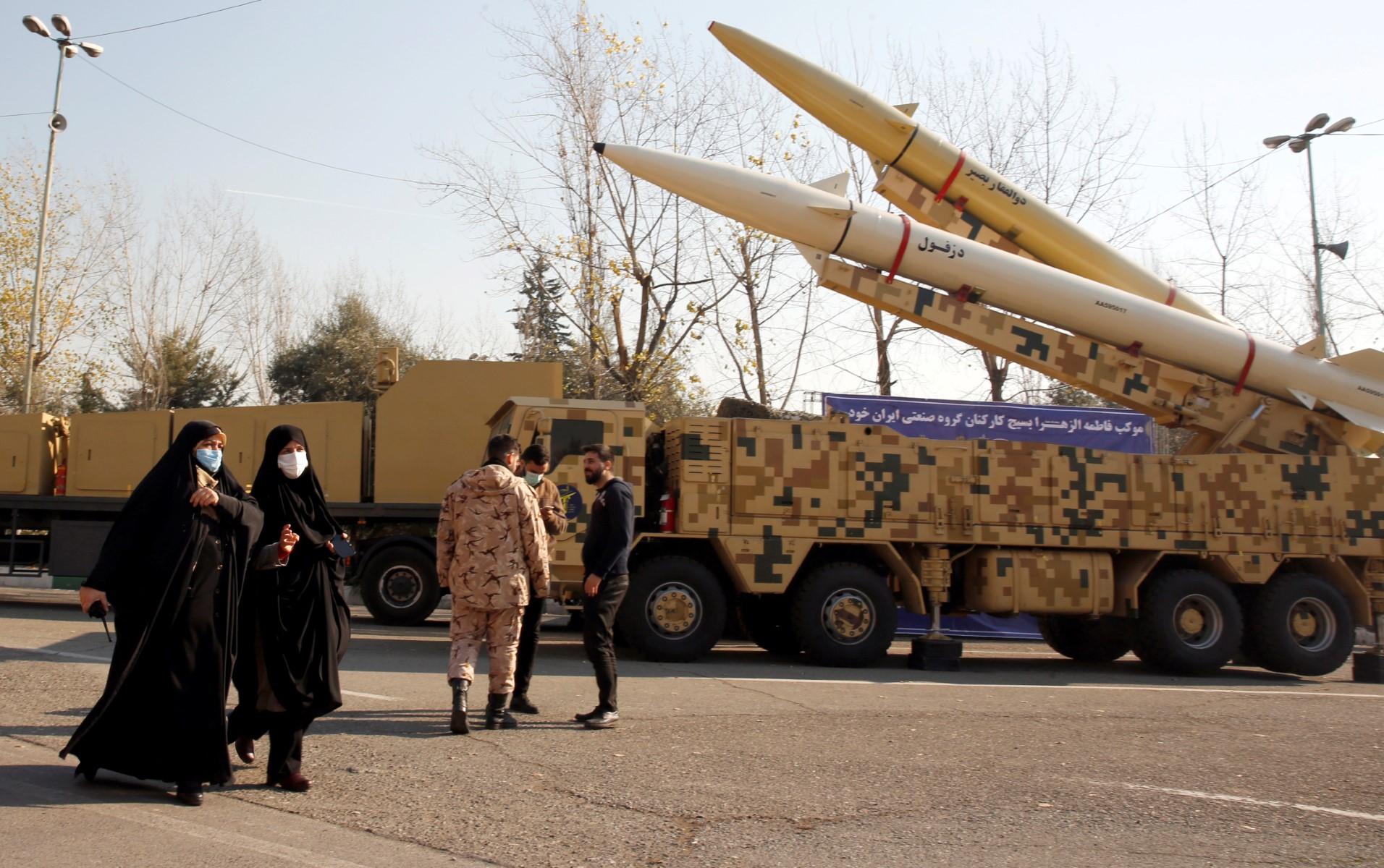 Iranian women walk next to Zolfaghar-Basir and Dezful missiles displayed at Mosallah mosque on the occasion of second anniversary of an Iran missile attack at a US military base in Iraq following the assassination of a former top Iranian commander, in Tehran, on Jan 7. Photo: AFP