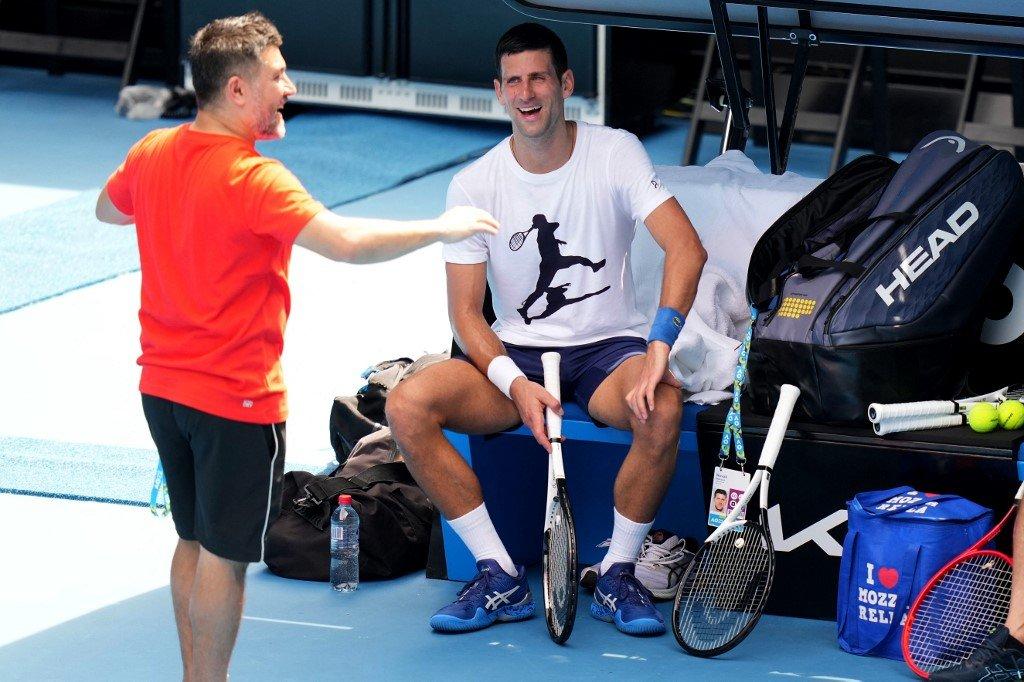 This handout photo taken and released by Tennis Australia on Jan 11 shows Serbia's Novak Djokovic (right) during a training session ahead of the Australian Open tennis tournament in Melbourne. Photo: AFP