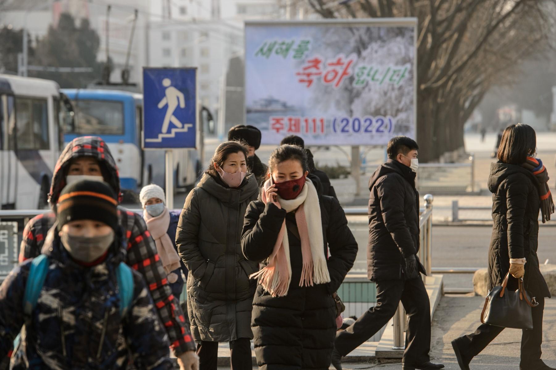 Pedestrians walk on a street in Pyongyang on Jan 1. A new report says researchers have identified US$170 million in old, unlaundered cryptocurrency holdings from 49 separate hacks spanning from 2017 to 2021. Photo: AFP