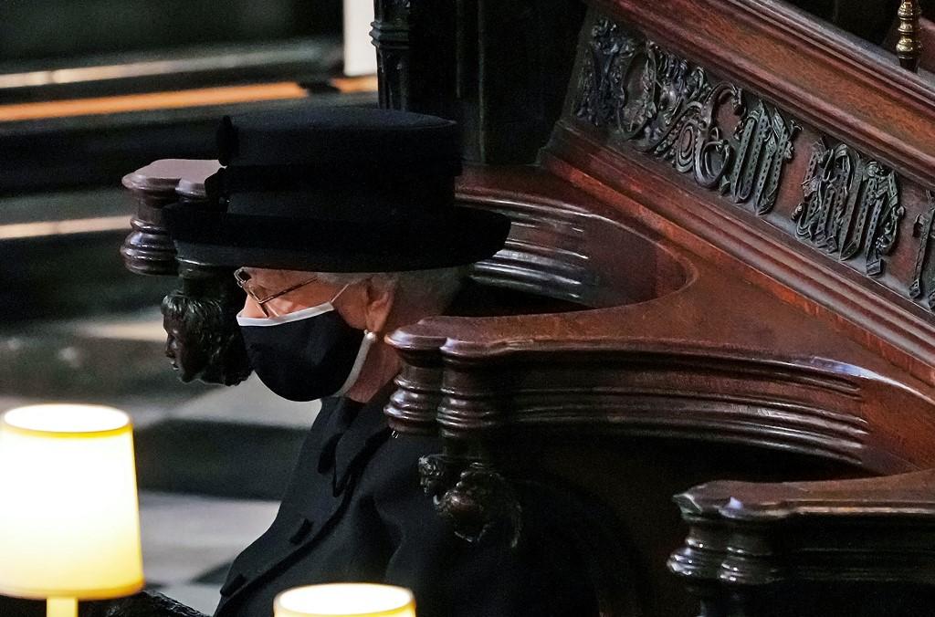 Britain's Queen Elizabeth II sits alone in the quire of St George's Chapel during the funeral service of her husband Britain's Prince Philip, Duke of Edinburgh in Windsor Castle in Windsor, west of London, on April 17, 2021. Photo: AFP