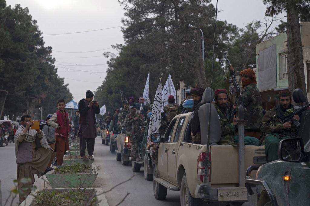In this photograph taken on Jan 16, Taliban fighters in vehicles take part in a military street parade in Maymana, capital of Faryab province. Photo: AFP