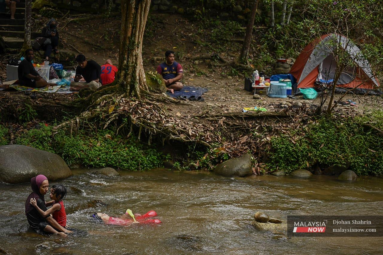 Families enjoy a day out at Sungai Congkak in Hulu Langat, Selangor.