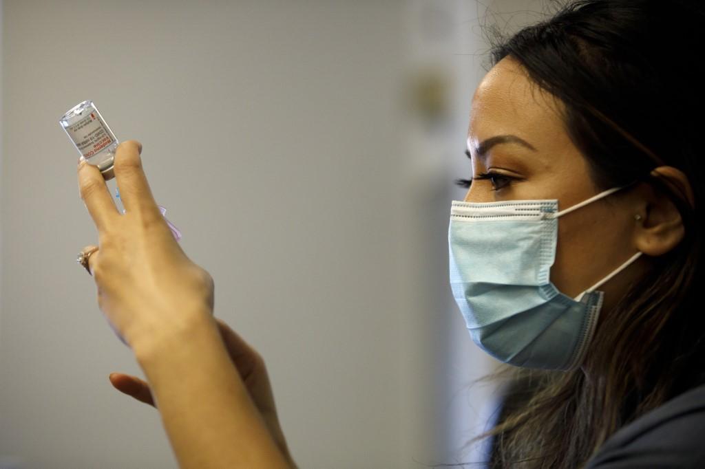 A nurse draws a dose of the Moderna Covid-19 vaccine as nurses from Humber River Hospital staff administer vaccines to residents, staff, and volunteers at one of B'nai Brith Canada's affordable housing buildings on March 23, 2021 in Toronto, Canada.  Photo: AFP