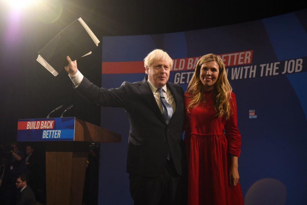 Britain's Prime Minister Boris Johnson gestures next to his wife Carrie Johnson after delivering his keynote speech on the final day of the annual Conservative Party Conference at the Manchester Central convention centre in Manchester, northwest England, on Oct 6, 2021. Photo: AFP