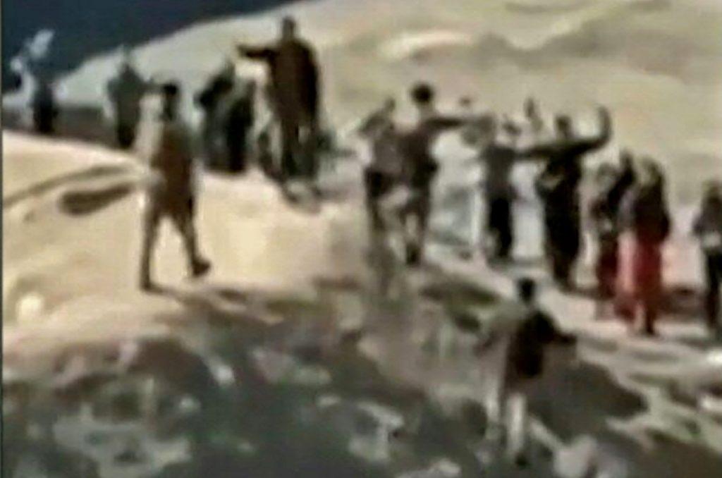 An image grab taken from a video posted online by the Syrian Democratic Forces on Jan 24 reportedly shows Islamic State group detainees surrendering to SDF fighters outside the Ghwayran prison in the northern Syrian city of Hasakeh. Photo: AFP