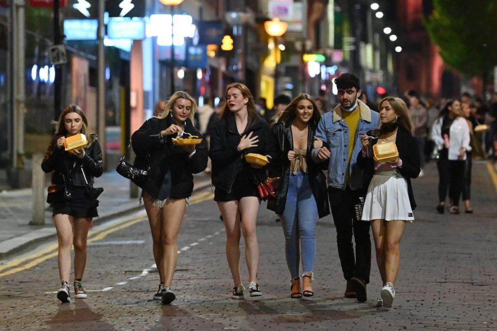 Pedestrians walk through central Liverpool, north west England on Oct 13, 2020, before fresh local lockdowns were imposed to help stem a second wave of Covid-19. Photo: AFP