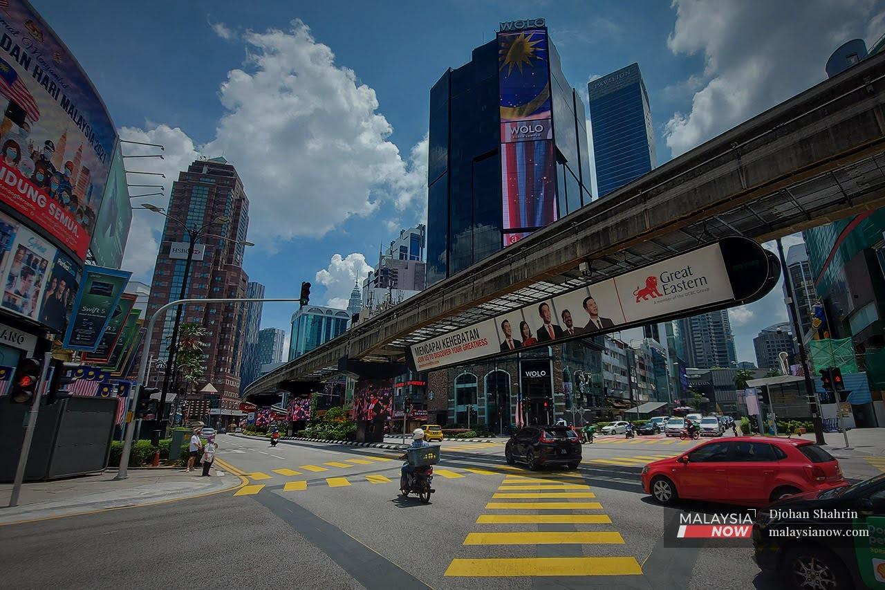 Traffic moves in the heart of the Golden Triangle in Kuala Lumpur.