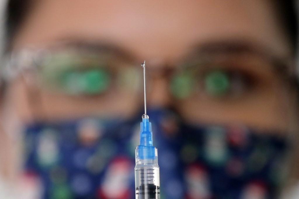 The UK Health Security Agency says Covid-19 booster shots increase protection against death from the Omicron variant to 95% in people aged 50 or over. Photo: AFP