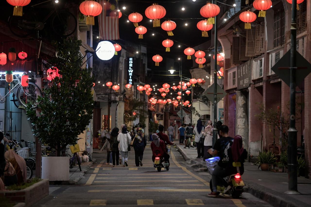 Tourists take an evening stroll at Armenian Street in George Town, Penang. Photo: Bernama