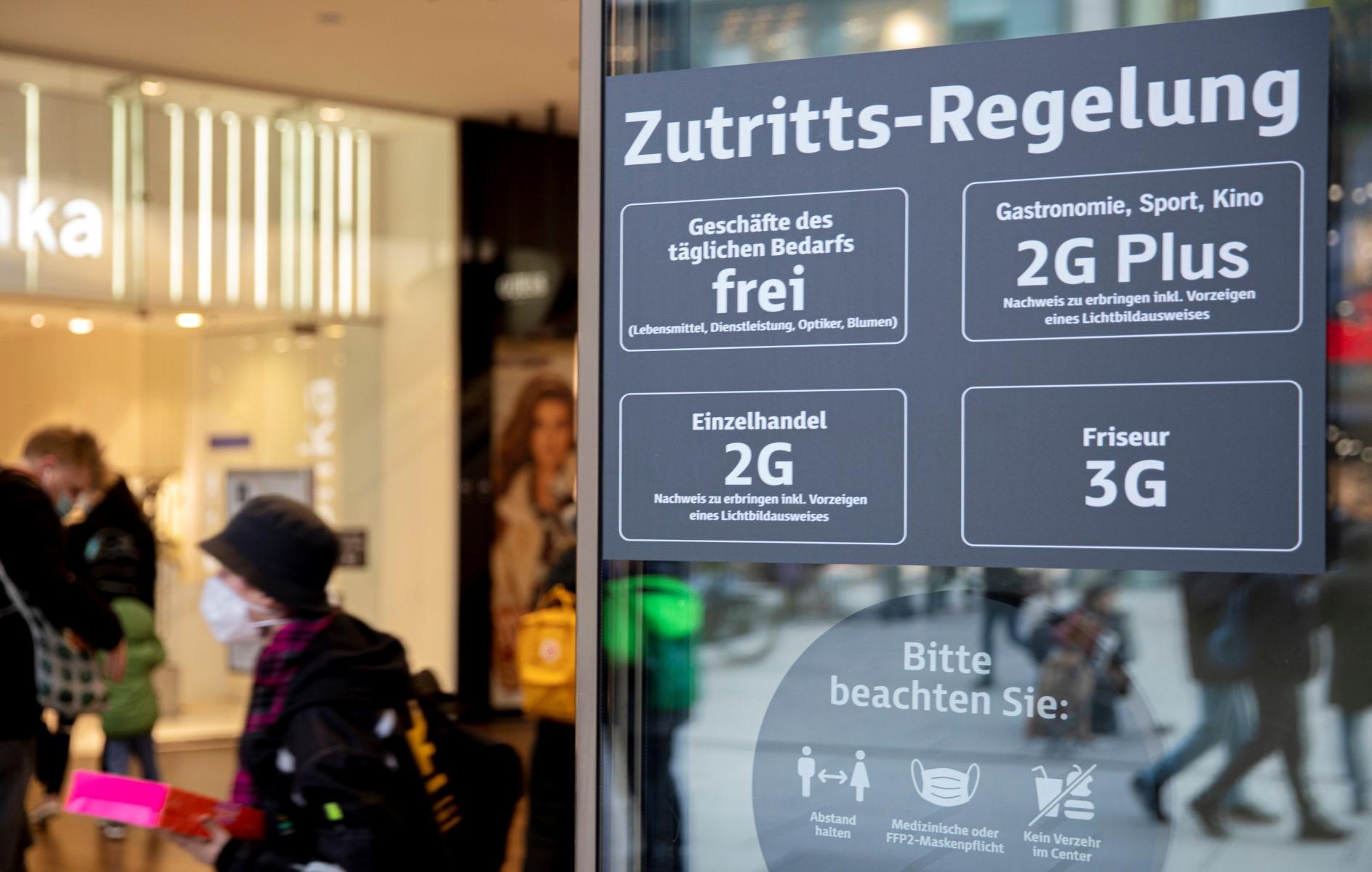 A sign is pictured at the entrance of a shop informing the public of the so-called Covid-19 '2G rules' allowing only vaccinated or recovered people to enter the store in Frankfurt am Main, western Germany, on Feb 3. Photo: AFP