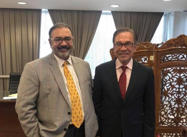 Vinod Sekhar, seen here with PKR leader Anwar Ibrahim, is the subject of a multi-agency investigation into allegations of money laundering. Photo: Facebook