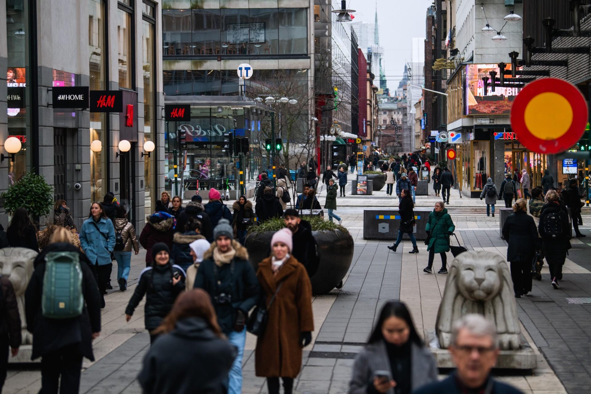 People visit one of Stockholm's busiest shopping streets on Feb 4, during the ongoing Covid-19 pandemic. Photo: AFP