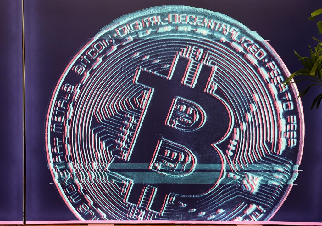 A bitcoin image hangs on the wall during the North American Bitcoin Conference held at the James L Knight Center on Jan 19 in Miami, Florida. Photo: AFP