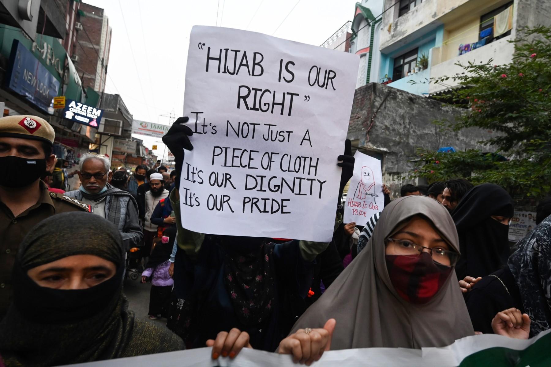 Activists hold placards and march during a demonstration in New Delhi, on Feb 9, to protest after students at government-run high schools in India's Karnataka state were told not to wear hijabs in the premises of the institute. Photo: AFP